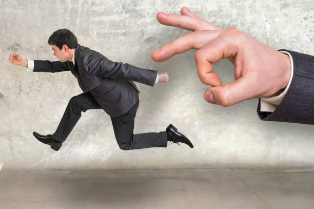 istock Small businessman running away from a boss pressure 656919994