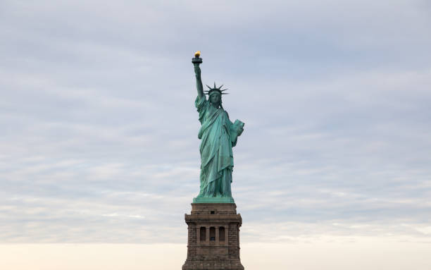 Statue of Liberty with cloudy sky stock photo