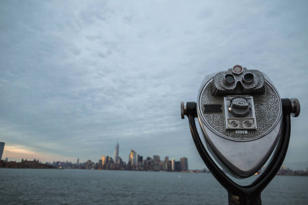 Coin-operated binoculars and the island of Manhattan. stock photo