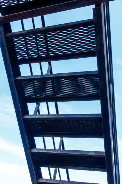 istock Silhouette black metal stairs against the sky. 656929138
