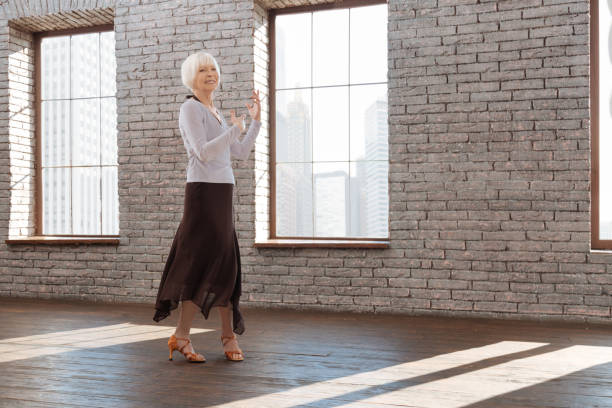 istock Inspired senior woman tangoing at the dance lesson 656929226