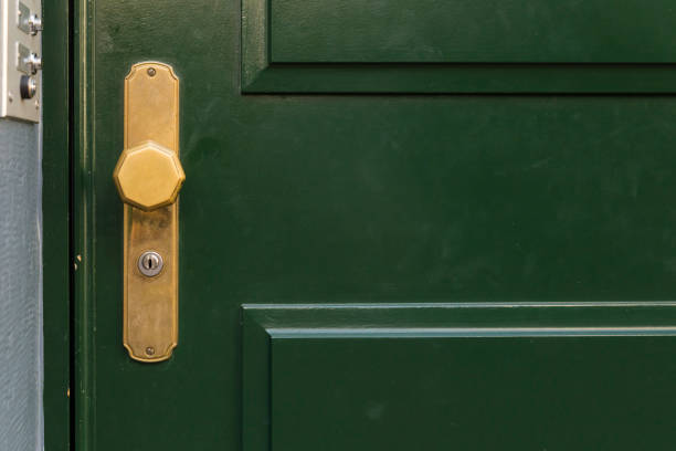 istock Green door with golden knob 656929716