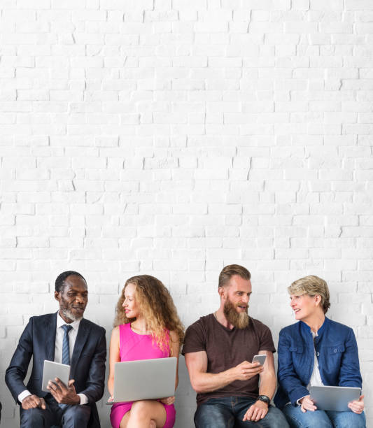 Diverse Group of People Community Togetherness Technology Sitting Concept