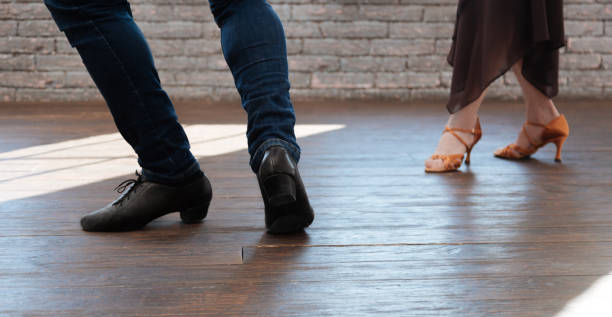 istock Graceful dance couple tangoing in the ballroom 656930158