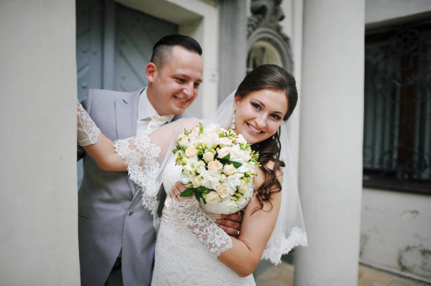 istock Wedding couple near old stone colums 656932908