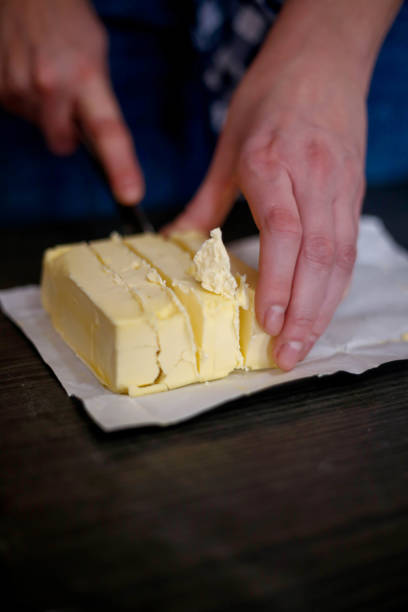 istock Hand hold the knife cutting the butter 656933098