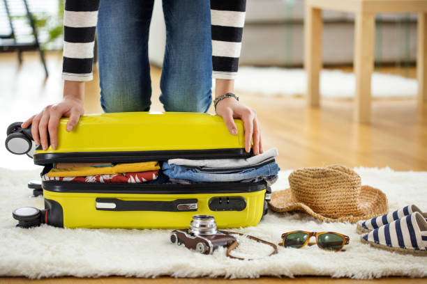 istock Preparation travel suitcase at home 656939464