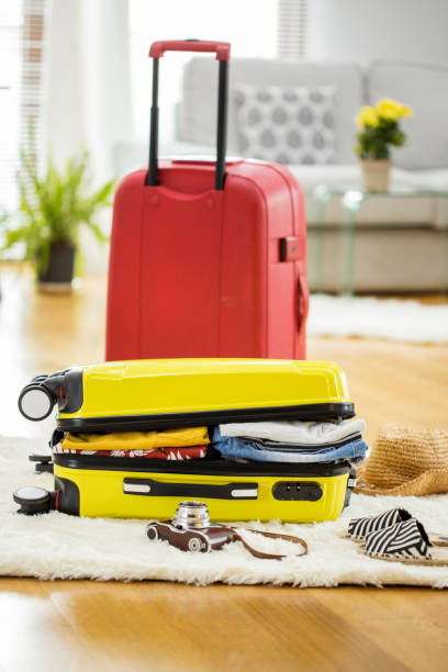 istock Preparation travel suitcase at home 656939528