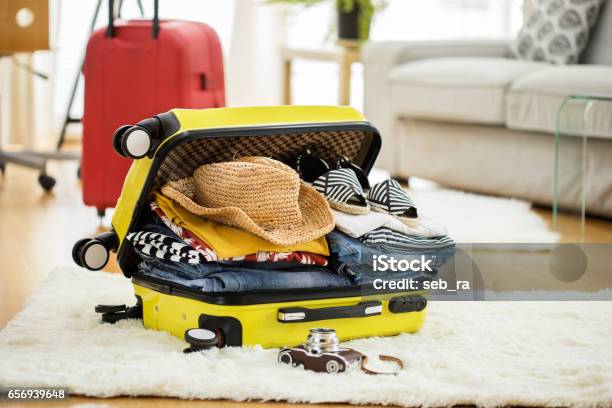 Preparation Travel Suitcase At Home Stock Photo - Download Image Now - Suitcase, Vacations, Packing