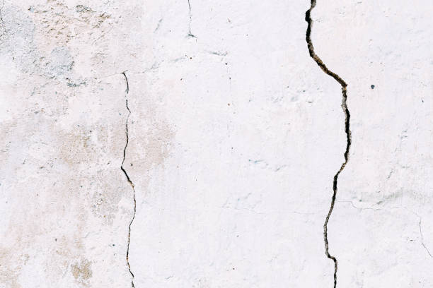 istock Grunge concrete cement wall with crack 656943584