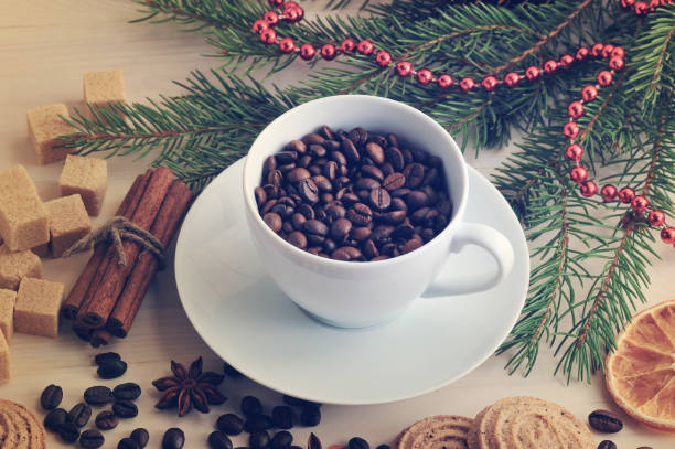 istock coffee beans poured into a mug at the Christmas backdrop from sugar 656944344