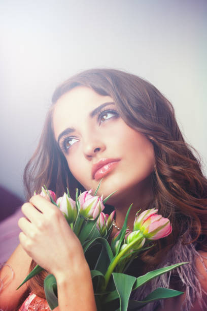 istock Young woman with tulips 656944350