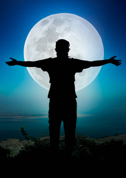 istock Silhouette of child enjoying and jumping at riverside. 656944410