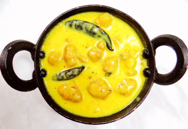 Kadhi Pakoad Kadhi Pakoad; Kadhi, an Indian comfort food of dumplings in yogurt sauce. Indian cuisine, Indian style food. karahi stock pictures, royalty-free photos & images