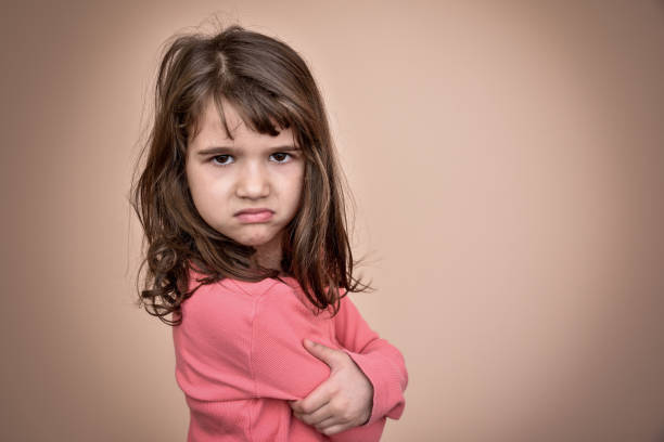 angry young girl - frowning imagens e fotografias de stock