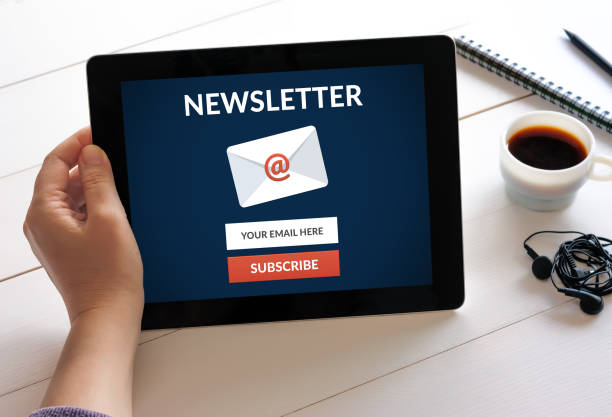 istock Hand holding tablet with subscribe newsletter concept on screen. 656954120