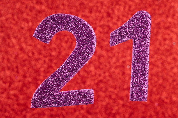 istock Number twenty-one purple over a red background. Anniversary. 656954430