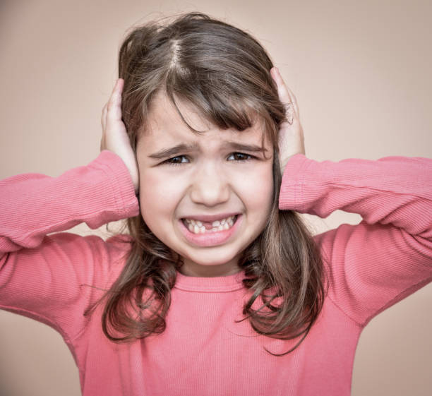 istock Young girl covering her ears 656954654