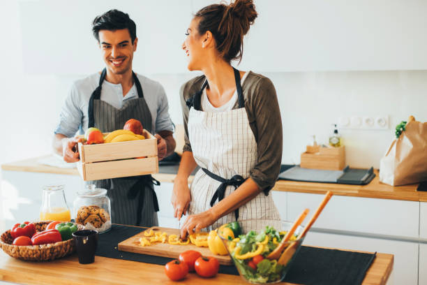 istock Young couple cooking in the kitchen 656957506