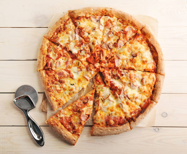 istock pizza with cheese and spicy sausage cut into slices 656958488