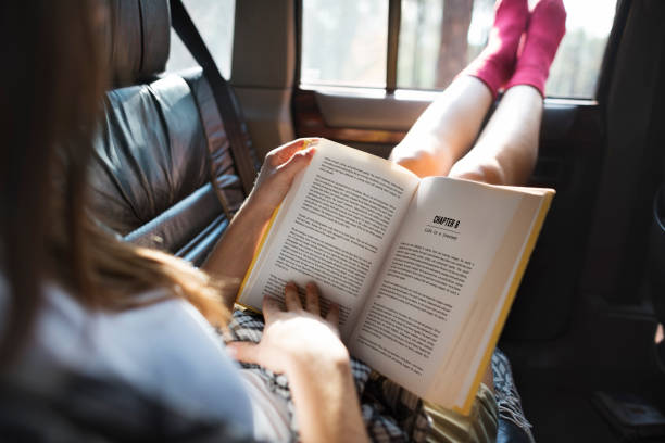istock Girl Reading Book Road Trip Concept 656959142