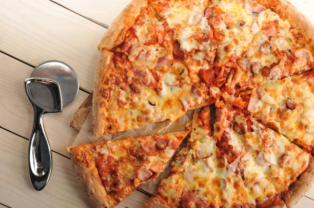 istock pizza with cheese and spicy sausage cut into slices 656961270