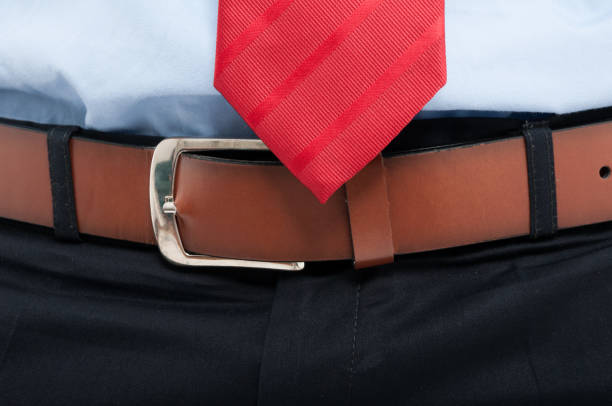 istock Close-up of man belt and red tie 656968976