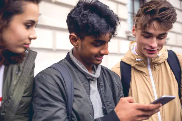 Photo of Students chatting on mobile phone