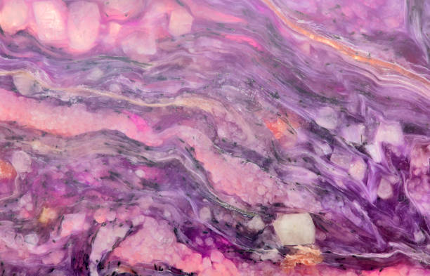 istock charoite stone pink and dark lilac background 656971872