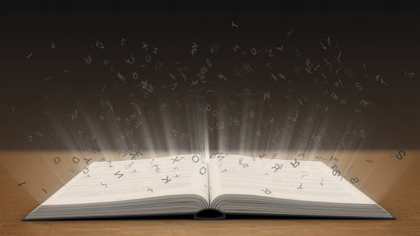 istock Glowing alphabet letters coming out of an book 656976490