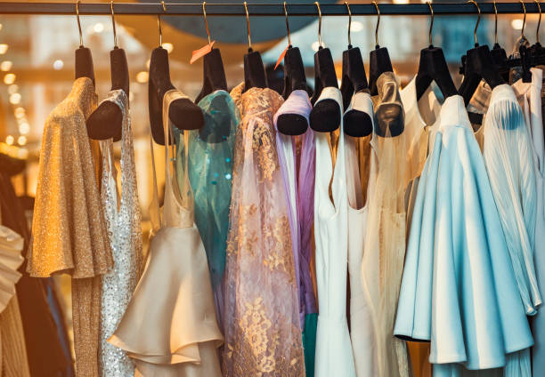 Colorful clorhes on racks in a fashion boutique Colorful clorhes on racks in a fashion boutique dress stock pictures, royalty-free photos & images