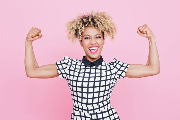 istock Happy afro american young woman flexing arms 656983838