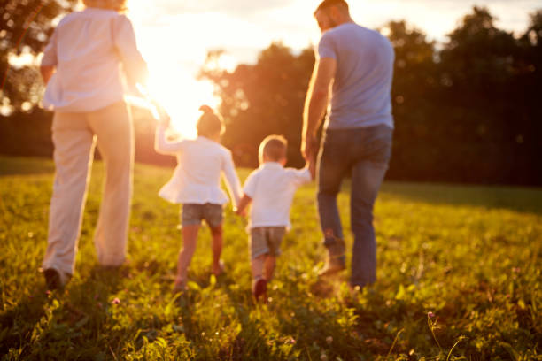 istock Blurred background of family in nature 656984094