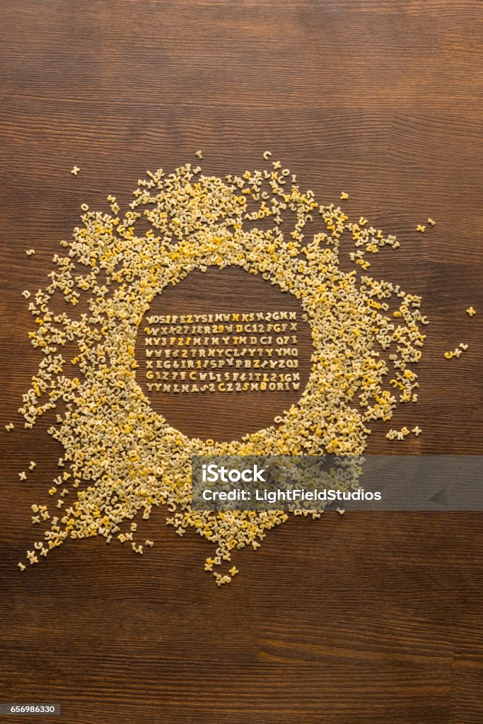 macaroni alphabet letters top view of macaroni alphabet and numbers on table Alphabet Stock Photo