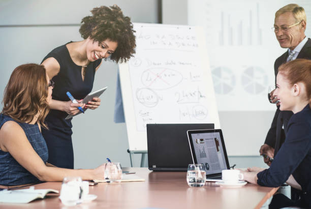istock Small Group of Business People Having a Presentation in the Board Room 656989964