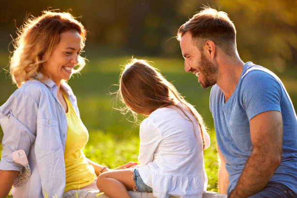 istock Girl with parents outdoor 656990032