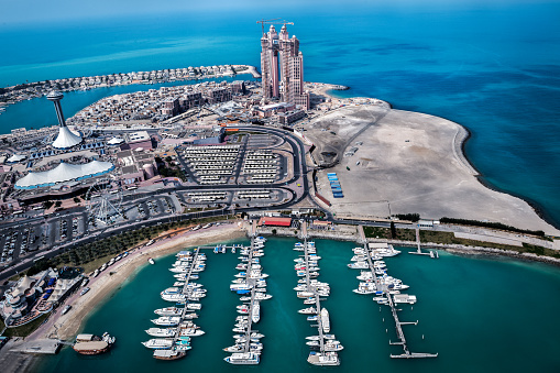 Aerial view of a bay in Abu Dhabi, UAE with Fairmont Hotel in the background during construction.
