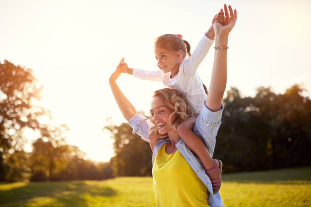 istock Happy mother with daughter enjoying in park 656990380