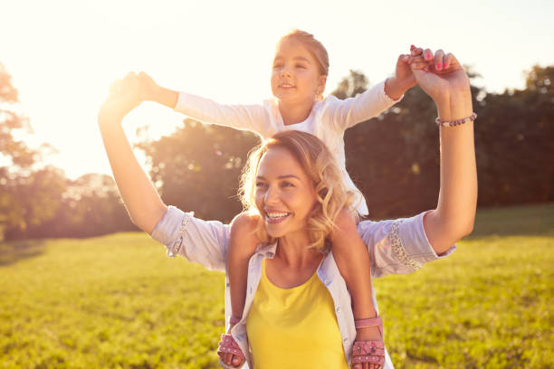 istock Mom and female child on her shoulders 656991746