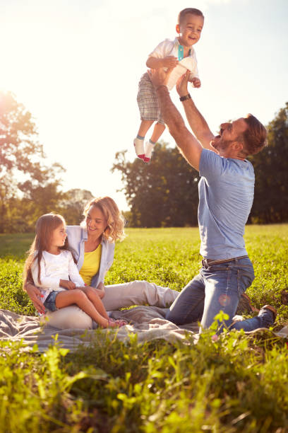 istock Parents have fun with children on picnic 656992372