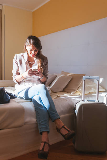 istock Woman in Hotel Bedroom 656993482