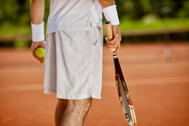 istock Tennis player on court, back view 656998400