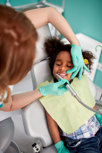 istock Dental polish teeth to young patient 656999052