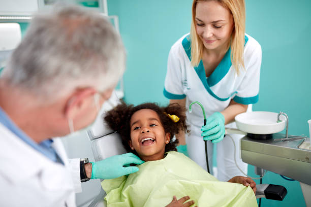 istock Little black patient show teeth to her dentist 657001710