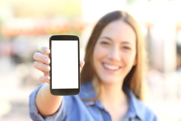 istock Girl showing a blank smart phone display 657002306