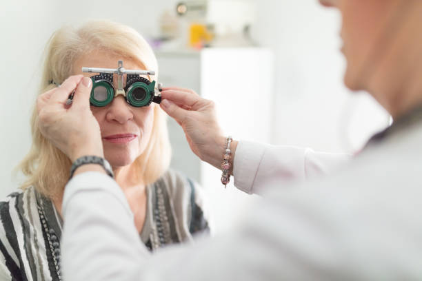 istock Senior woman trying test frames on 657003928