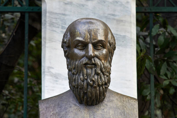 A bronze bust on a marble pedestal honors Juan Manuel Rodriguez Ojeda, designer of Sevillian Holy Week, in front of Basílica de la Macarena.