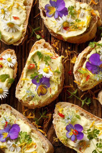 istock Canapes with eddible flowers and broad bean hummus 657017416
