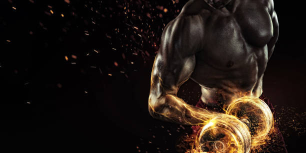 Creative Sport. Closeup portrait of professional bodybuilder with fire Sport and fitness body building stock pictures, royalty-free photos & images
