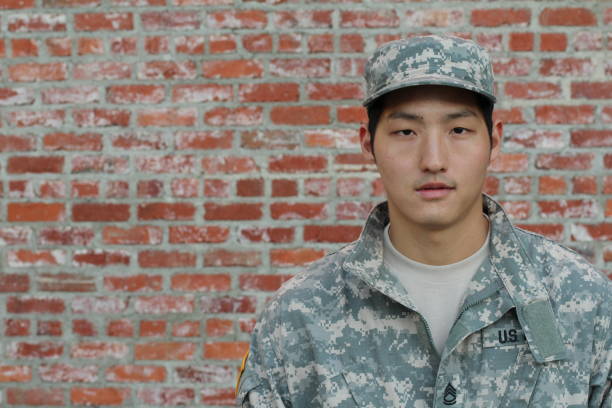 istock Army Asian male isolated on brick wall 657020834